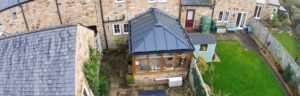 Oak colour PVCu conservatory with LivinRoof roof system
